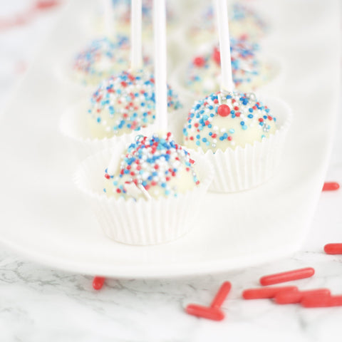 Witte cakelollies met rood/wit/blauwe sprinkles