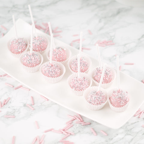 Roze gedipte cakelollies met prachtige sprinkles